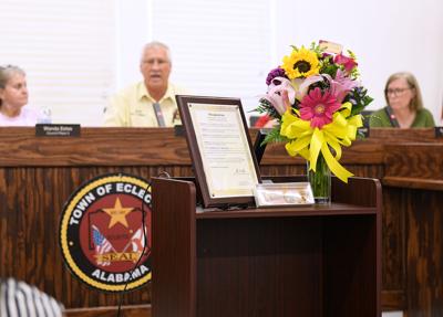 Cliff Williams / TPI The Town of Eclectic recognized the retiring Minnie Johnson who served as director of the Eclectic Senior Center for the last 14 years. The recognization included flowers, a key to the town and a proclamation.