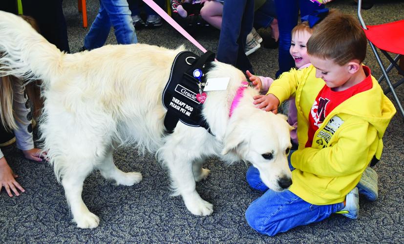 Auburn Therapy Dogs visit children’s library