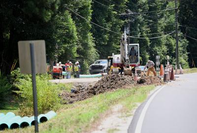 Cliff Williams / TPI Construction crews install a 12 inch pressurized sewer line along Airport Road in Coosada Tuesday morning.