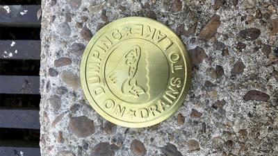 City storm drains marked to raise awareness