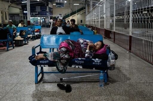 People dozed on station benches or sat on luggage on  platforms as they waited for their trains