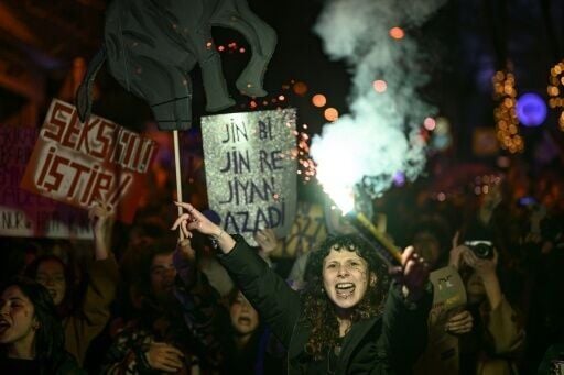 Women hold placards reading 'Women, life, freedom' at a march for International Women's Day in Istanbul