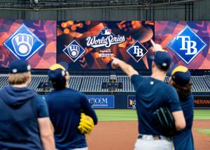 Milwaukee Brewers players point towards a fly ball during a workout and practice session ahead of Game 3 of the World Series