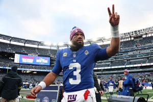 New York Giants quarterback Russell Wilson (3) waves to fans after the game against the Dallas Cowboys on January 4 at MetLife Stadium.