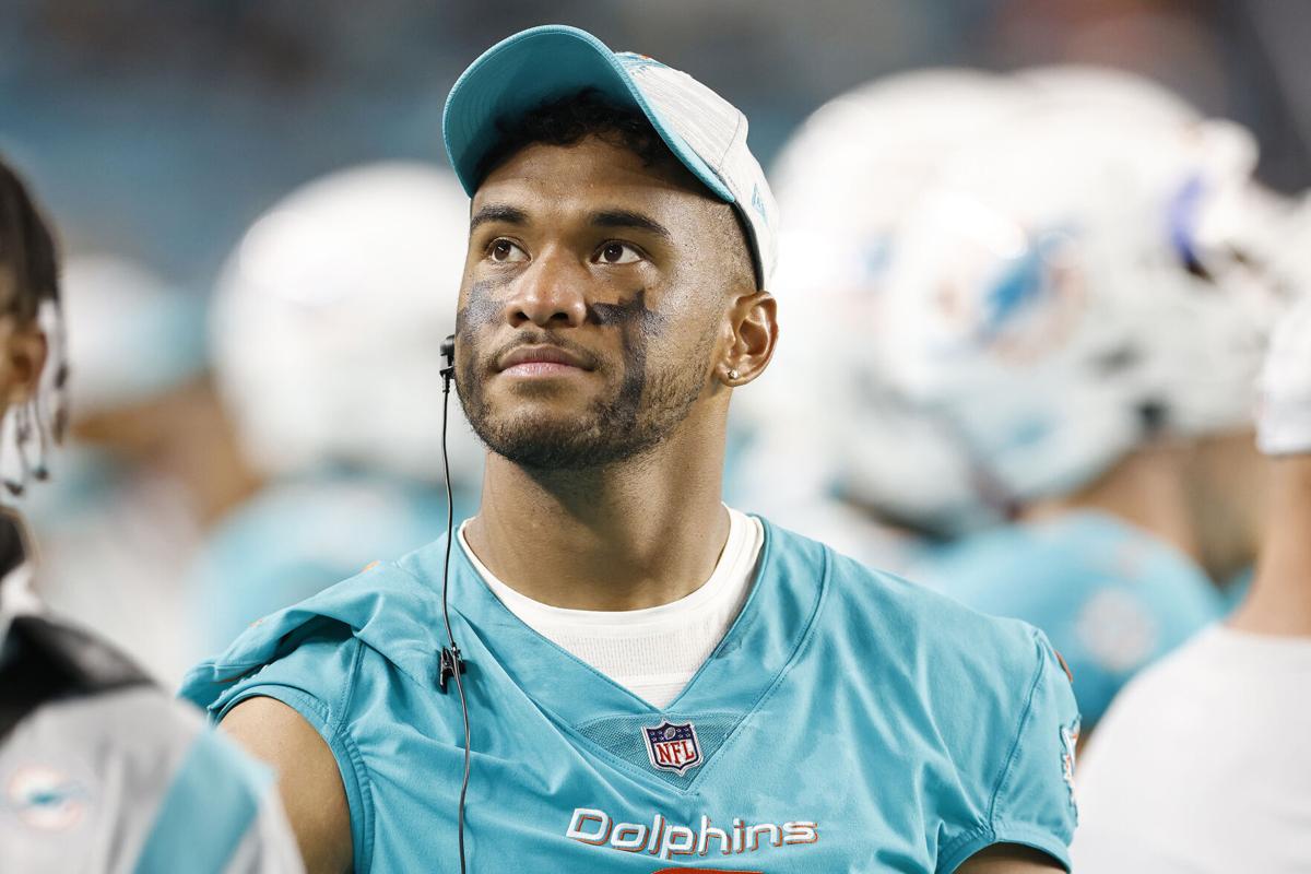 Miami Dolphins quarterback Tua Tagovailoa looks on during a preseason game against the Atlanta Falcons at Hard Rock Stadium on August 21, 2021, in Miami Gardens, Florida.