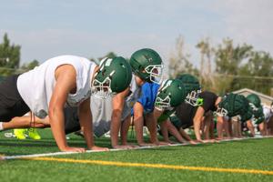 High school football practice kicks off