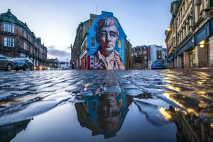 Kilmarnock does not only boast a castle but a local celebration of famed poet Robert Burns. Here, the Robert Burns Mural, created by artist Michael Corr on the the gable-end wall of the Robert Burns World Federation building in Kilmarnock, East Ayrsh
