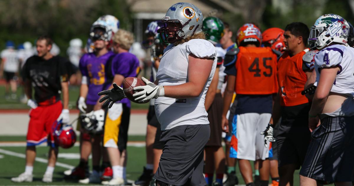 Gavin Ruh Wyoming linemen Gavin Rush, Patrick Arnold try to get hold on center ...