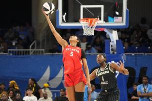 Atlanta Dream forward Angel Reese (5) is defended by Chicago Sky center-forward Elizabeth Williams (1) during the first half at Wintrust Arena on Jun 9, 2026 in Chicago, Illinois.