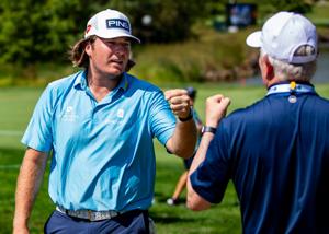Neal Shipley, the second-round leader at 15-under, exchanges a fist bump during the Biltmore Championship Asheville at The Cliffs at Walnut Cove on Sept. 18, 2026.