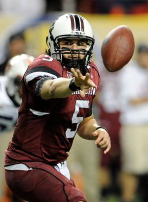 Dec 4, 2010; Atlanta, GA, USA; South Carolina Gamecocks quarterback Stephen Garcia (5) pitches the ball on an option run during the first half of the 2010 SEC championship game against the Auburn Tigers at the Georgia Dome. Mandatory Credit: John Dav