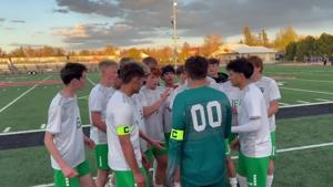 Kelly Walsh boys celebrate their Casper Cup victory over Natrona County.