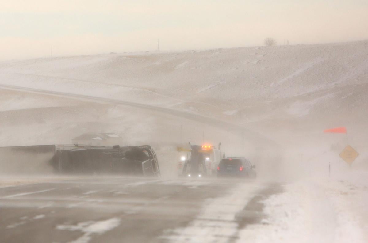 High winds cause dozens of crashes; video shows semi jackknife on icy