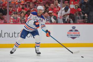 Jun 12, 2025; Sunrise, Florida, USA; Edmonton Oilers defenseman Darnell Nurse (25) passes the puck during the second period against the Florida Panthers in game four of the 2025 Stanley Cup Final at Amerant Bank Arena. Mandatory Credit: Sam Navarro-I