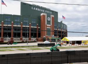 A forklift drives along Lombardi Avenue inside the NFL Draft perimeter on Sunday, April 27, 2025, at Lambeau Field in Green Bay,
