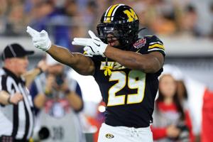 Missouri Tigers running back Ahmad Hardy (29) reacts to his first down pickup during the first quarter of the TaxSlayer Gator