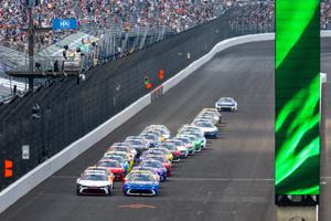 The field races toward Turn 1 after taking the green flag on a restart following an on-track incident Sunday, July 26, 2026
