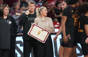 ASU Sun Devils head coach Molly Miller talks to her team on the sidelines as they play the Kansas State Wildcats at Desert Financial Arena in Tempe on Feb. 1, 2026.