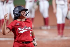 Texas Tech catcher Jasmyn Burns (12) hits a home run in the fifth inning of the second softball game between Texas Tech and Alabama at the Women’s College World Series at Devon Park in Oklahoma City, on Monday, June 1, 2026.