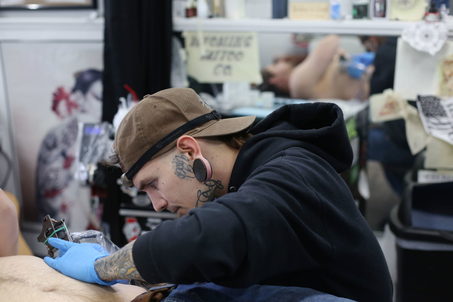 Portrait of Rob Kelly, tattooer and owner of BLACKOUT, holding a... News  Photo - Getty Images