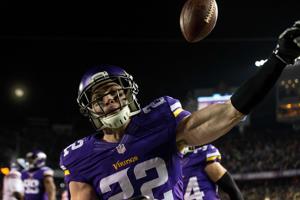Dec 27, 2015; Minneapolis, MN, USA; Minnesota Vikings safety Harrison Smith (22) celebrates his interception for a touchdown during the second quarter against the New York Giants at TCF Bank Stadium. Mandatory Credit: Brace Hemmelgarn-USA TODAY Sport