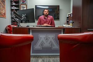 Jeremiah Carter, the Minnesota Gophers' executive associate athletic director for NIL and risk management, sits in his office in the Athletes Village complex on July 17.