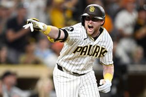 The Padres' Jake Cronenworth celebrates after hitting a walk-off single during the ninth inning against the Giants at Petco Park in San Diego on Aug. 1, 2026.