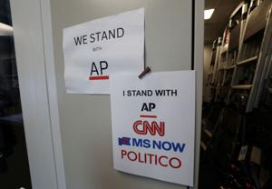 CNN, MSNOW and Politico solidarity signs at the White House in Washington