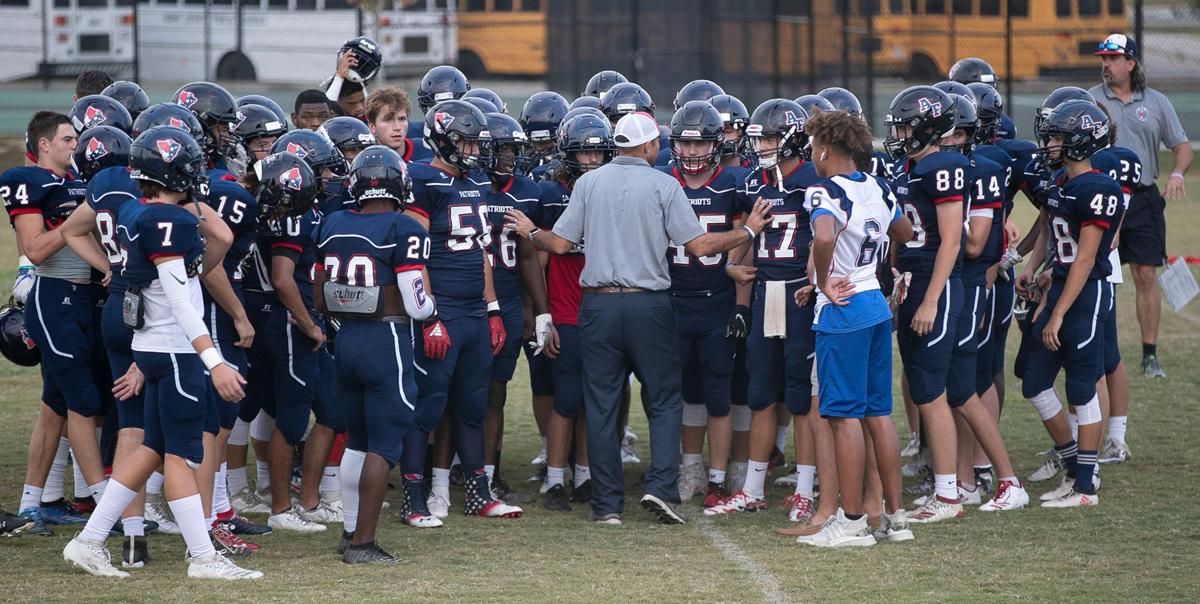 Apex Friendship coach Adam Sanders talks with his players prior to the conclusion of their game against Middle Creek on Monday, Sept. 30, 2019 in Apex, N.C.