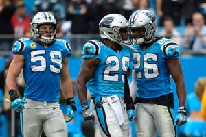 Nov 5, 2017; Charlotte, NC, USA; Carolina Panthers strong safety Mike Adams (29) celebrates with middle linebacker Luke Kuechly (59) and cornerback Daryl Worley (26) after intercepting a pass at Bank of America Stadium. Mandatory Credit: Bob Donnan-U