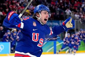 USA defenseman Quinn Hughes celebrates his overtime goal against Sweden.