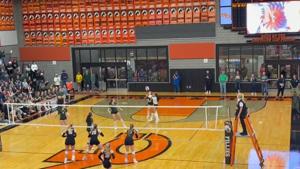 Kelly Walsh players and students celebrate after Lillian Hudson's kill completes the Trojans' sweep of Natrona County in the VolleyBowl on Thursday night.