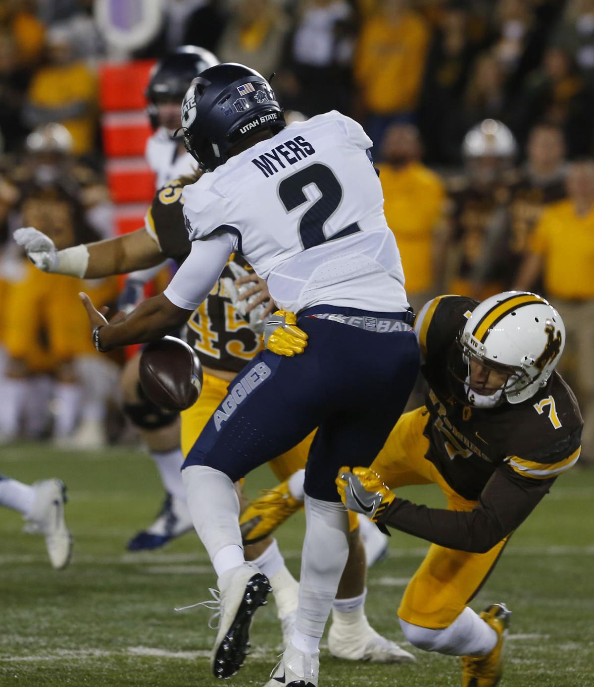 Wyoming football survives thirdquarter scare to defeat Utah State 52