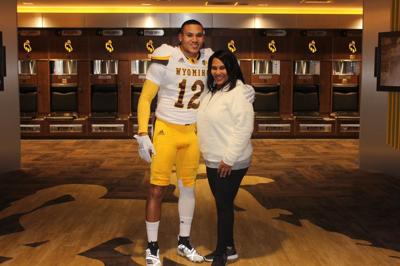 smith trey wyoming louisville transfer trib football sandra announced former recent running seen mother during visit his