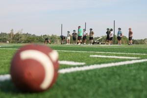 High school football practice kicks off