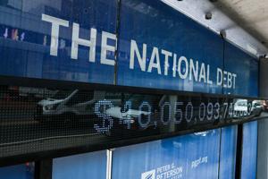 A sign displays national debt on a bus stop in the Foggy Bottom neighborhood of Washington, D.C., on Aug. 20, 2026.