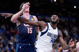 Dallas' Moussa Cisse (30) fight for a rebound with Oklahoma City's Branden Carlson (15) during the NBA game between the Oklahoma City Thunder and the Dallas Mavericks at the Paycom Center in Oklahoma City, Friday Dec. 5, 2025.