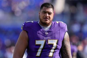 Nov 12, 2023; Baltimore, Maryland, USA; Baltimore Ravens offensive tackle Daniel Faalele (77) looks on before a game against the Cleveland Browns at M&T Bank Stadium. Mandatory Credit: Jessica Rapfogel-USA TODAY Sports