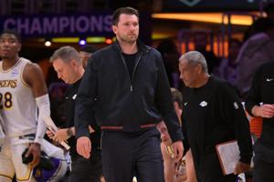 May 9, 2026; Los Angeles, California, USA; Los Angeles Lakers guard Luka Doncic (77) looks on from the bench in the final minutes of game three of the second round of the 2026 NBA Playoffs against the Oklahoma City Thunder at Crypto.com Arena. Mandat