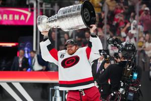 Carolina Hurricanes goaltender Frederik Andersen (31) raises the Stanley Cup after his team defeated the Vegas Golden Knights in Game 6.
