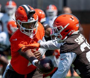 Shedeur Sanders hands the ball to Dylan Sampson during a 7 on 7 at the Browns mini camp in Berea on April 21, 2026.