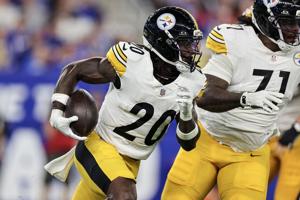 Kaleb Johnson #20 of the Pittsburgh Steelers runs the ball around right end during the third quarter of a preseason game against the Buffalo Bills at Highmark Stadium on Aug. 27, 2026, in Orchard Park, New York.