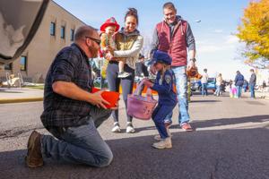 PHOTOS: Candy, costumes & Halloween fun. Local first responders treat kids to a 'boo-tiful' trunk or treat