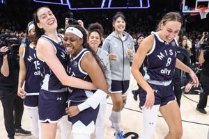 Mist BC wing Arike Ogunbowale (24) celebrates with her teammates after hitting a 3-point shot to defeat Breeze BC.