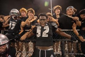 St. Peter Prep's Olubobola Oluwasemilore (52) celebrate with fans during a high school football game between St. Peterâ€™s Prep and Paramus Catholic in Jersey City on Friday, Aug. 29, 2025.