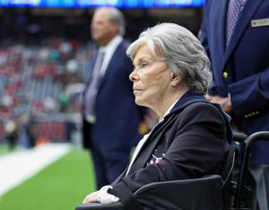 Houston Texans co-founder and former owner Janice McNair looks on with son and Texans chief executive officer Cal McNair in the background before a game against the Miami Dolphins at NRG Stadium in Houston on Dec. 15, 2024.