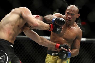 Cormier chokes out Lewis; defends 2nd title at UFC 230