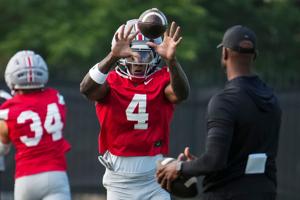 Ohio State Buckeyes wide receiver Jeremiah Smith (4) catches a pass during the first practice of training camp at the Woody