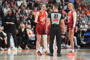 Indiana Fever guard Caitlin Clark (22) speaks with an official after being called for a technical foul.