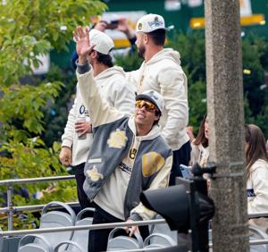 Milwaukee Brewers designated hitter Christian Yelich (22) waves to the crowd during the World Series parade in Milwaukee, on Oct. 30, 2026.